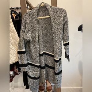 Grey cardigan with white and black stripes